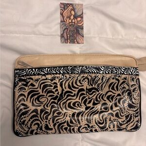 Hand painted one of a kind tan, black, white and blue leather bag.